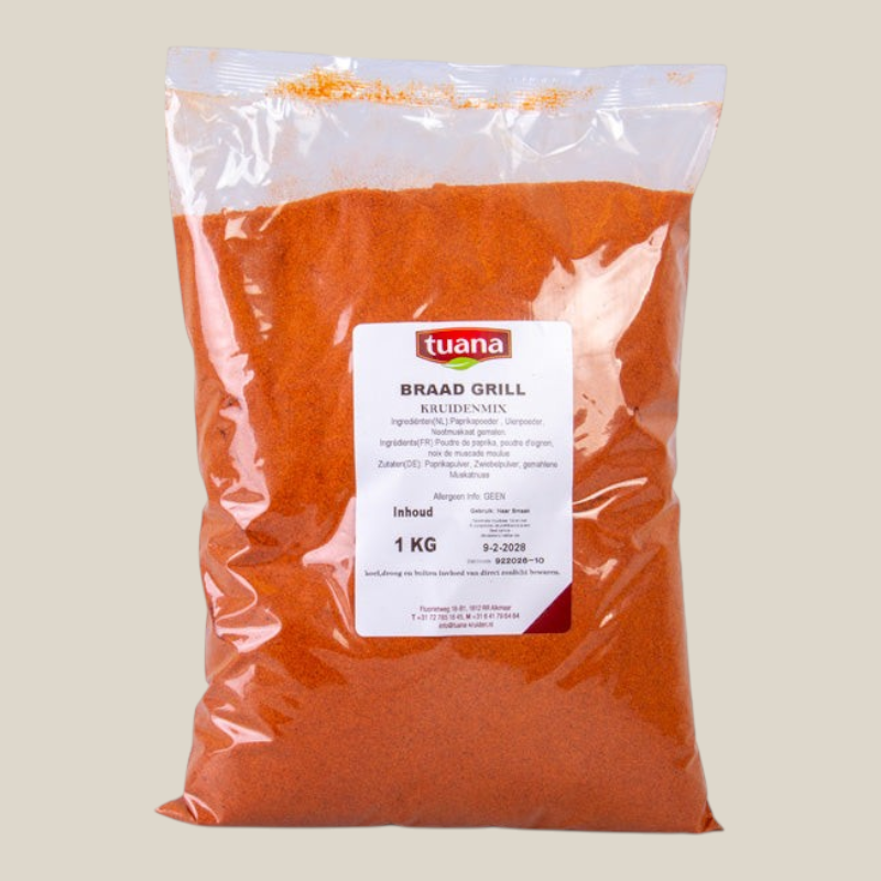 TuanaShop BV Braad- en Grill Kruidenmix in een transparante verpakking van 1 kg met paprikapoeder en uienpoeder.