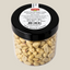 TuanaShop BV geblancheerde jumbo pinda's in een doorzichtige pot met zwart deksel en productinformatie label.
