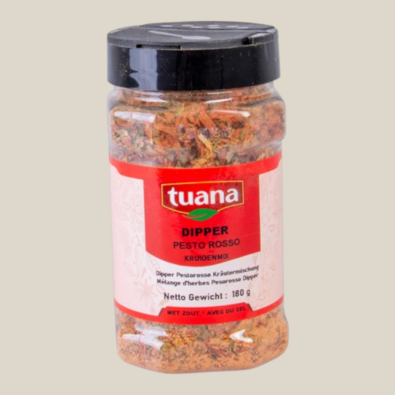 TuanaShop BV Dipper Pesto Rosso kruidenmix in een doorzichtige pot met rode etiket en zwarte schroefdop.