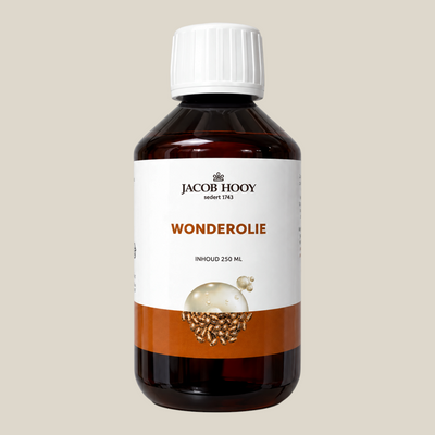 TuanaShop BV Jacob Hooy wonderolie in een bruine glazen fles van 250 ml voor huid- en haarverzorging.