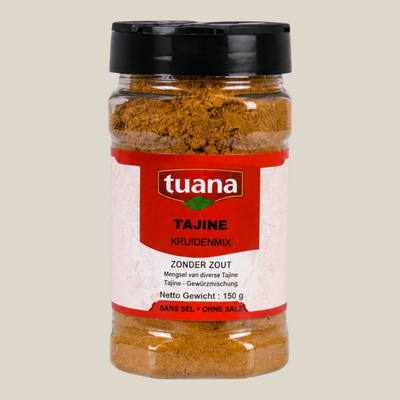 TuanaShop BV Tajine kruidenmix zonder zout in een doorzichtige pot met zwarte dop en rood etiket.