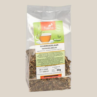 TuanaShop BV Toverhazelaar blad gesneden in een transparante verpakking van 60 gram voor thee of mondspoeling.